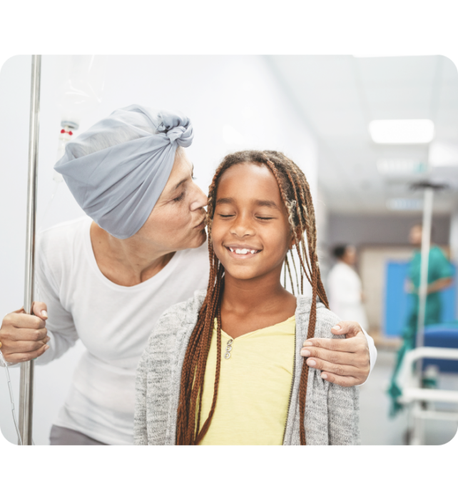 Sick woman kissing a little girl's cheek