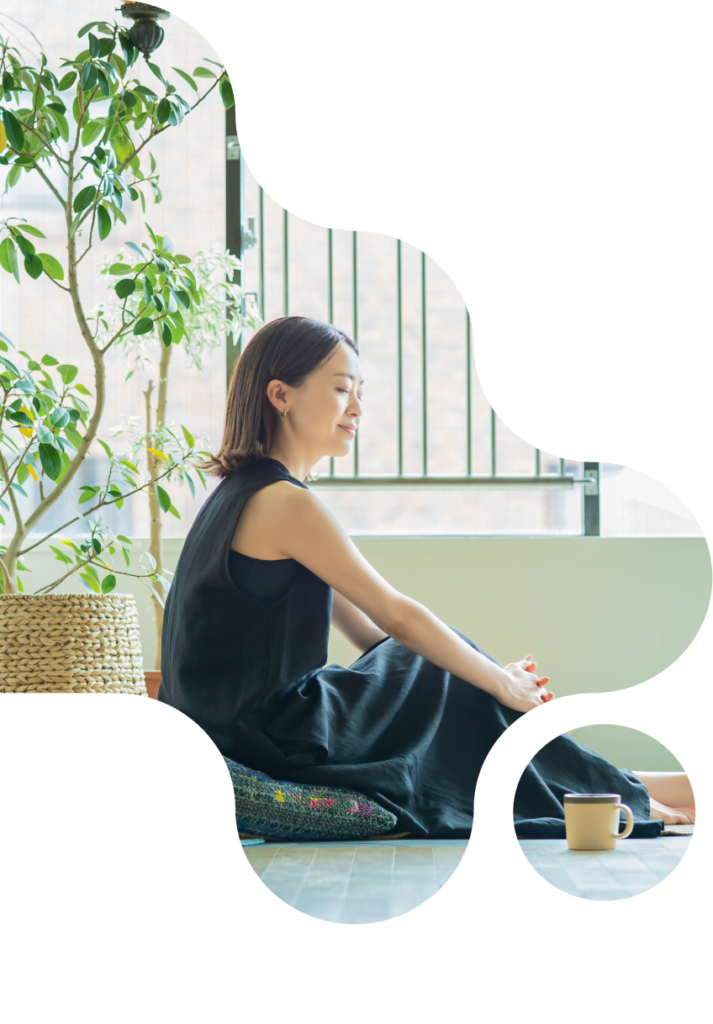 Woman sitting next to her coffee on a pillow