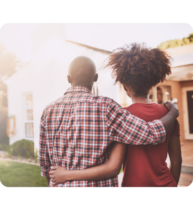 Back view of a couple holding each others